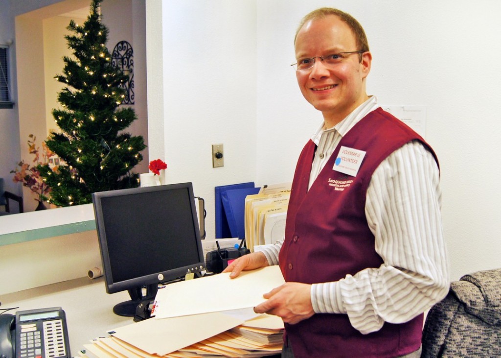 Snoqualmie Valley HospitalVolkmar Gaussmann stops long enough for a photo at Snoqualmie Valley Hospital, where he volunteers about three hours per week. Photo by By Lindsey Oliver