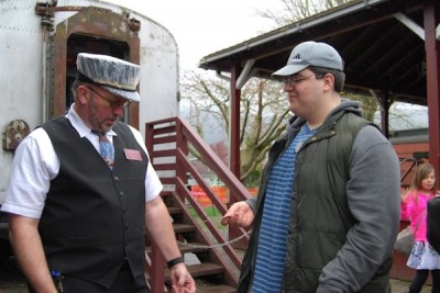 First passenger boarding NW Railway Museum train for the 2013 season.  Photo: Museum Facebook page
