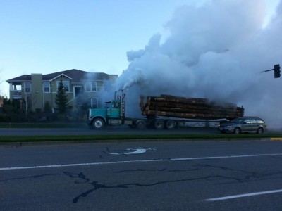 Ailing logging truck traveling up Snoqualmie Parkway, 4/1/13