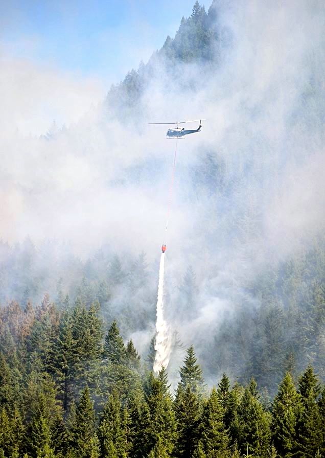 DNR helicopter performs water drop on Mt Si fire on 7/26/13. Photo by Aviv Stern