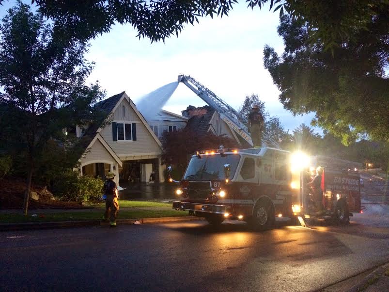 Snoqualmie Firefighters still spraying burnt home hours after fire ignited on July 4, 2014