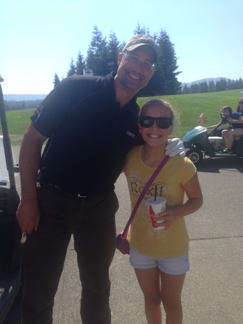 Former Seattle Sounder Kasey Keller taking photos with young fans on the course.