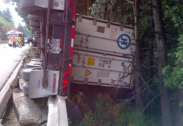 Semi truck hanging over the edge of westbound SR 18 near the Tiger Mountain summit