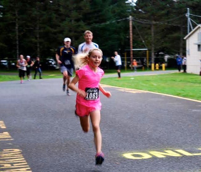 Amber Debu, 150 feet away from Fall City Half Marathon finish line, 10/11/12.