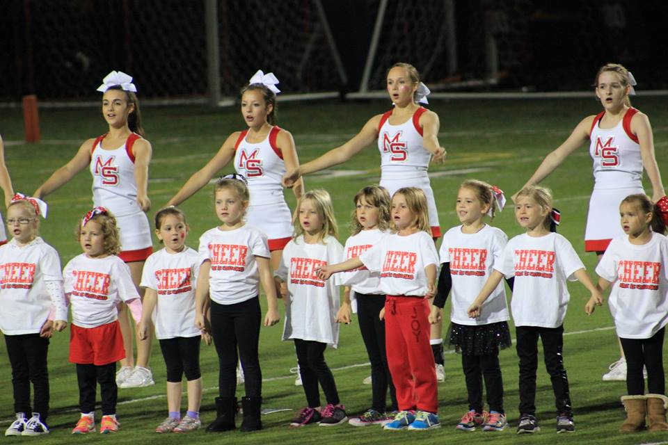 Mini Cheer Camp attendees performing at halftime of the 10/3/14 MSHS football game.