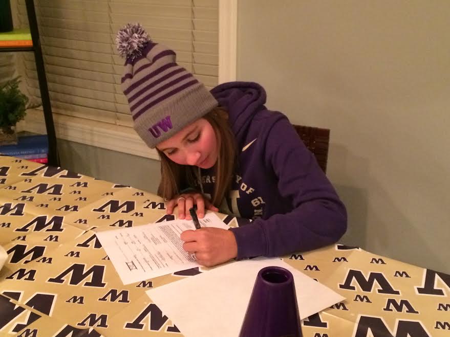 Madison Mariani signing her letter of intent to join the UW Women's Crew Team next fall.