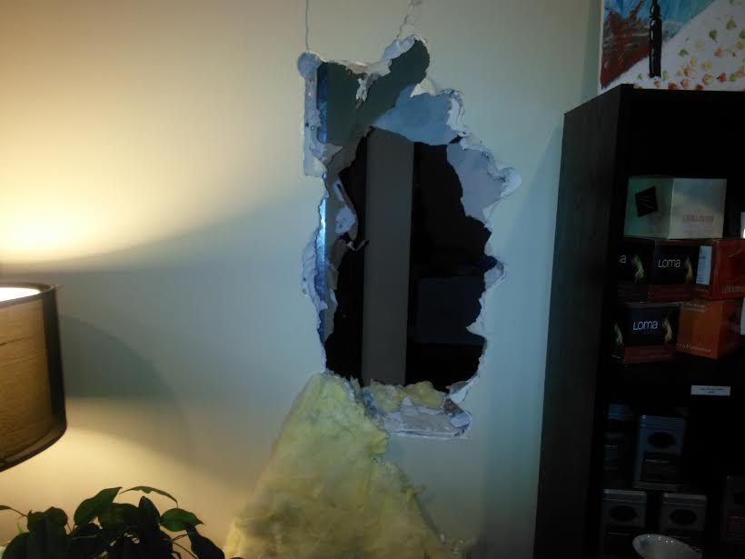 Hole hammered through Lula Ruby wall into neighboring Edward Jones business