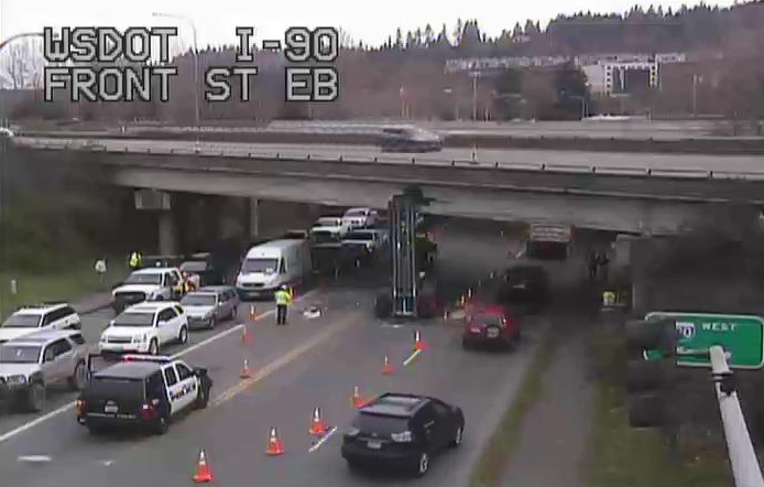 Garbage truck lift arm stuck in Front Street I-90 overpass, Friday morning, 3/13/15. Photo: WSDOT