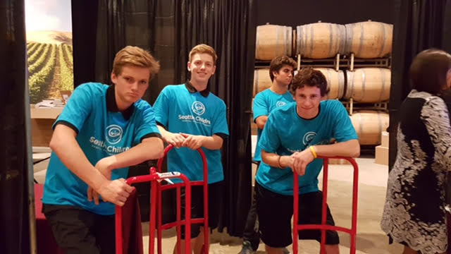 Helping out at Seattle Children's big yearly summer auction. Pictured left to right are: Cameron Stone, Ben Maclean, and Kade McNamara