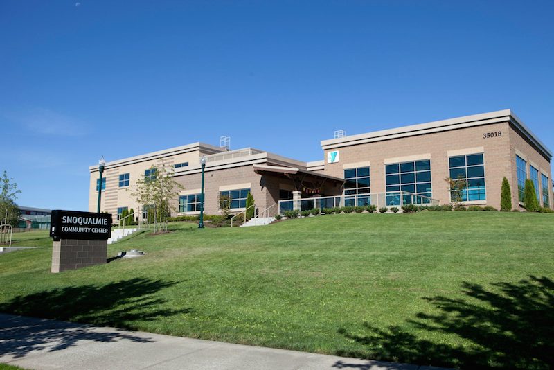 Snoqualmie Valley YMCA/Community Center situated on land parcel for future expansion , with possible pool, in grassy areas. Photo: Y Facebook page courtesy of Michelle D Garthe Photography.